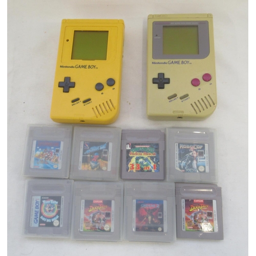 291A - Yellow and Grey Nintendo Gameboys (1 working the other not) with 8 game cartridges