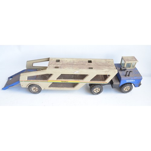 410 - Collection of large metal outdoors Tonka vehicles to include car transporter and wheel loader, a lar... 