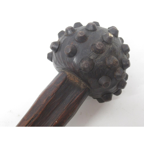 1611 - Knobkerrie type club with metal studded head, the grip with carved cross hatching, 87cm overall