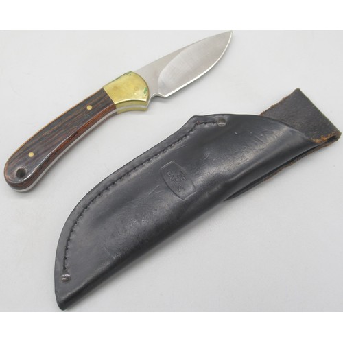 1609 - Model 113 Buck skinning knife. Full tang with two piece rosewood handle and brass bolster. Blade len... 