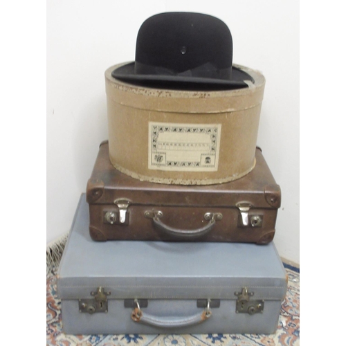 289 - Vintage J. Moores & Sons black bowler hat, small Vintage Globe-Trotter suite case and a blue leather... 