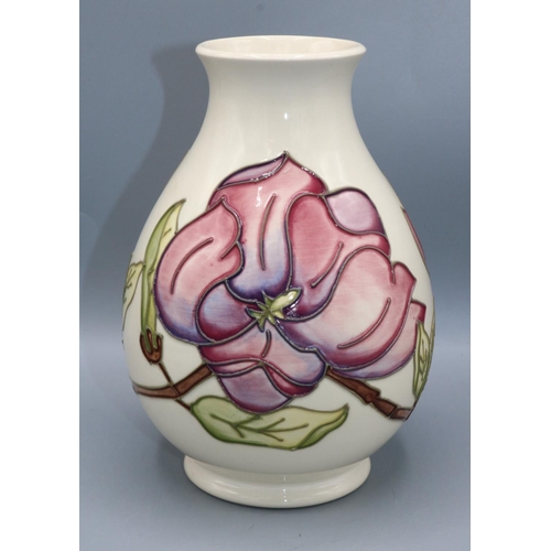 351 - Moorcroft Pottery: Magnolia pattern baluster vase, pink and purple flowers on off-white ground, H19.... 