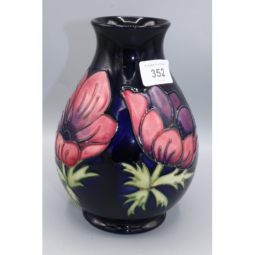 352 - Moorcroft Pottery: Anemone pattern baluster vase, red and purple flowers on dark blue ground, H19.5c... 