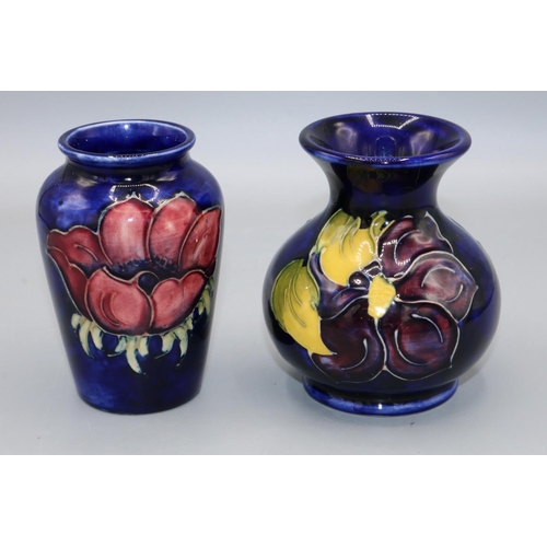 353 - Moorcroft Pottery: Clematis and Anemone pattern small vases, purple and red flowers on blue ground, ... 