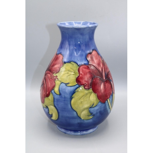 354 - Moorcroft Pottery: Hibiscus pattern baluster vase, red flowers on blue wash ground, Queen Mary stick... 