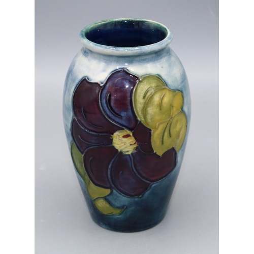 356 - Moorcroft Pottery: Clematis pattern small vase, graduated blue ground, Queen Mary sticker, H10.5cm