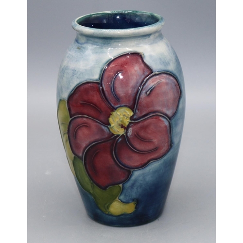 356 - Moorcroft Pottery: Clematis pattern small vase, graduated blue ground, Queen Mary sticker, H10.5cm