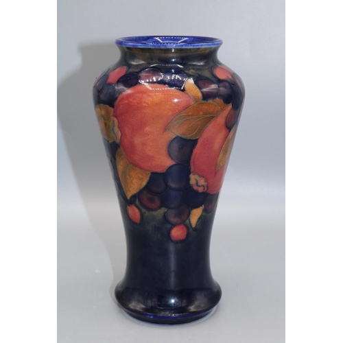 362 - Moorcroft Pottery: Pomegranate pattern high shouldered vase, fruit on dark blue ground, H18.5cm