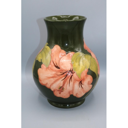 364 - Moorcroft Pottery: Hibiscus pattern baluster vase, coral flowers on green ground, H25cm