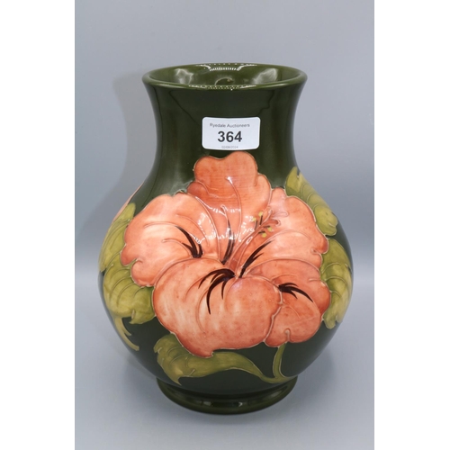 364 - Moorcroft Pottery: Hibiscus pattern baluster vase, coral flowers on green ground, H25cm