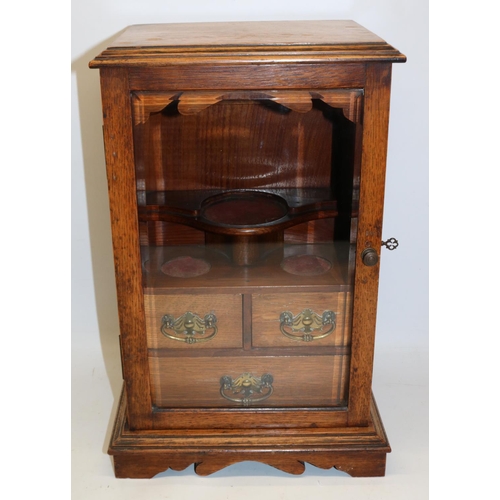 640 - Early 20th century oak smoker's cabinet, glazed bevel edged door enclosing fitted interior, H44cm