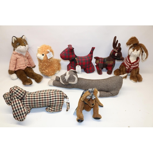 694 - Collection of fabric country style doorstops and soft toys, and a resin model of leaping stags H30cm