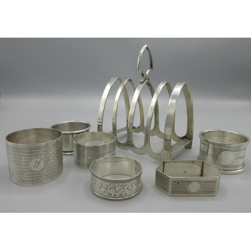 50 - 20th century silver toast rack by Viner's Ltd, Sheffield, 1939, and six silver napkin rings of vario... 