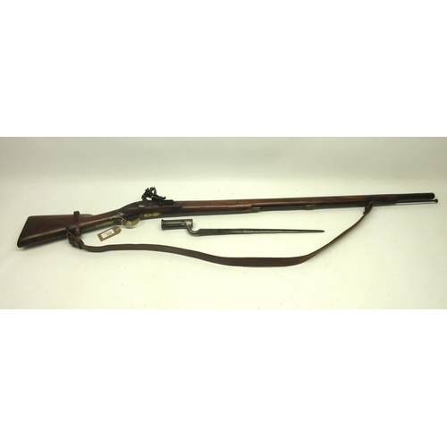 565 - A good copy of a East India Company flintlock 'Brown Bess' musket, dated 1776, . Barrel length 39'' ... 