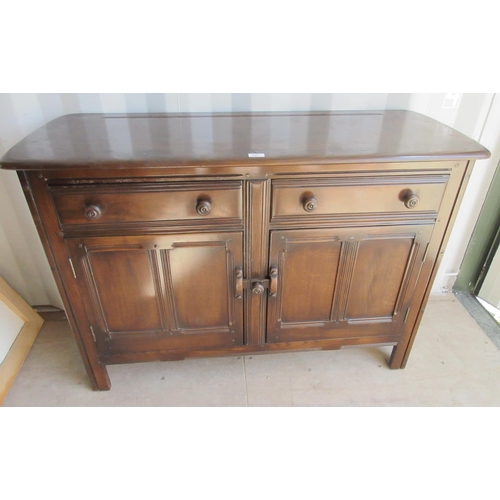 295 - Ercol dresser, two drawers above two doors, with blue label, W121cm D48cm H86cm