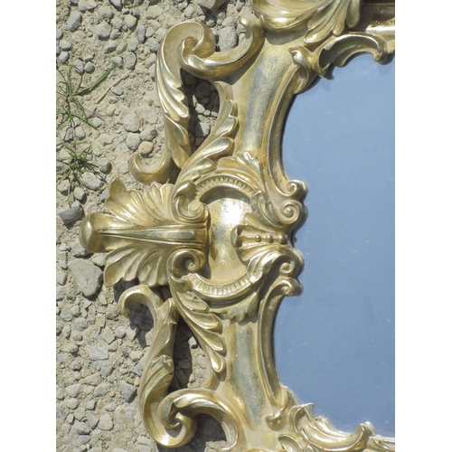 299 - Small Rococo style wall mirror in pierced scroll frame, H57cm W36cm