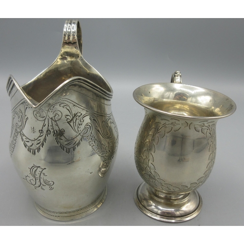 53 - George III silver jug with sweeping handle and chased with swags of flowers by Peter, Ann & William ... 