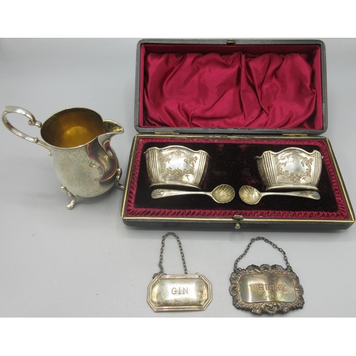 63 - Victorian silver pair of salts with engraved scrolling decoration, two spoons with shell bowls, in f... 