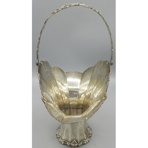 77 - George V silver basket with swing handle, lobed body and flared rim by Henry Matthews, Birmingham, 1... 