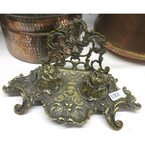 412 - Brass rococo style desk stand, four Eastern copper pans max. D29cm, brass coal scuttle, and a carpet... 