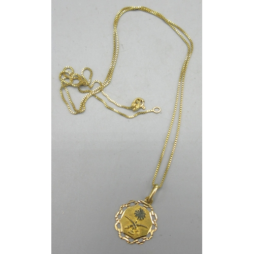 166 - 18ct yellow gold pendant with Saudi Arabian decoration, stamped 750, on 18ct yellow gold chain, stam... 