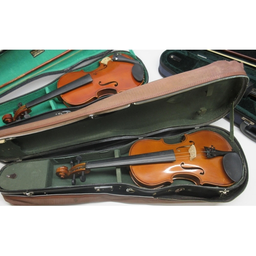 66 - Three cased Violins including Skylark brand Violin with bow, Lark Violin with two bows, and an Anton... 