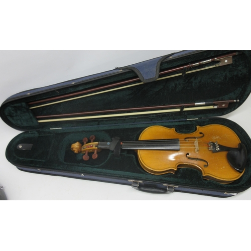 66 - Three cased Violins including Skylark brand Violin with bow, Lark Violin with two bows, and an Anton... 