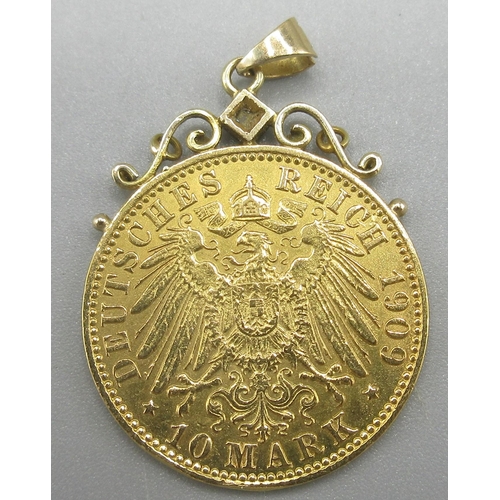 11 - Gold German 10 mark 1909 coin, mounted and set with single diamond, 4.36g