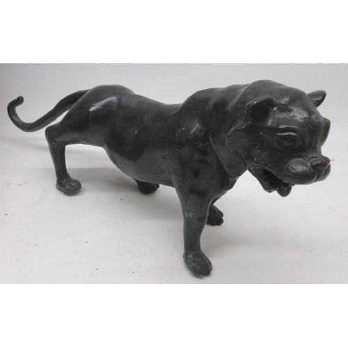 225 - Late 19th Century patinated spelter lion, tail repaired, L42cm; early 20th Century Continental ring ... 