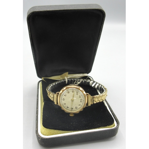 510 - Swiss ladies 9ct gold wristwatch on expanding gold plated bracelet, silvered Arabic dial, A.L.D. sna... 