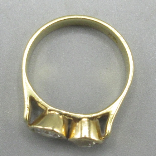 9 - 18ct yellow gold ring set with two round cut diamonds in rub over mounts, stamped 18k, size J, 3.84g