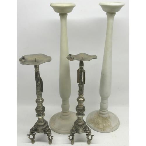 246 - Pair of white metal Tibetan style candle sticks with seal to base and two other large white candle s... 