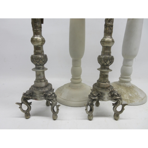 246 - Pair of white metal Tibetan style candle sticks with seal to base and two other large white candle s... 