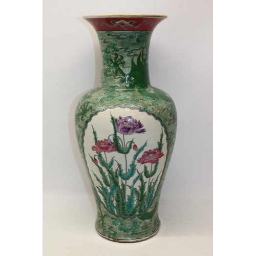 142 - Chinese porcelain baluster vase, decorated in enamels with two reserves painted with flowers, the gr... 