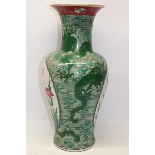 142 - Chinese porcelain baluster vase, decorated in enamels with two reserves painted with flowers, the gr... 