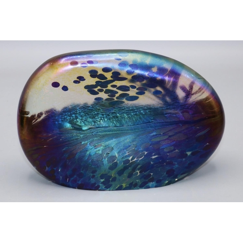 420 - John Ditchfield Glasform iridescent glass paperweight of compressed ovoid form, L15cm