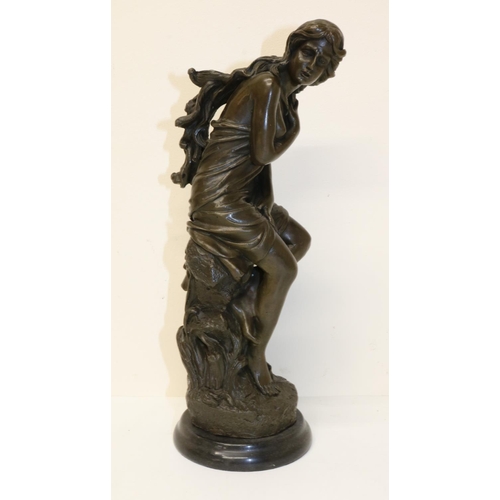 429 - Bronze figure of a semi-clad woman, on circular marble base, H29.5cm