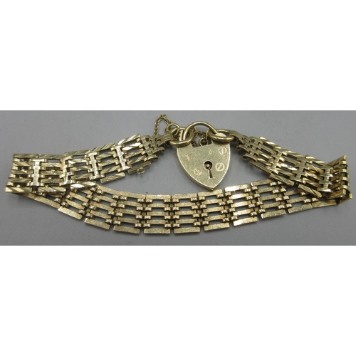 94 - 9ct yellow gold bar gate bracelet with padlock heart clasp and safety chain, stamped 375, 14.79g