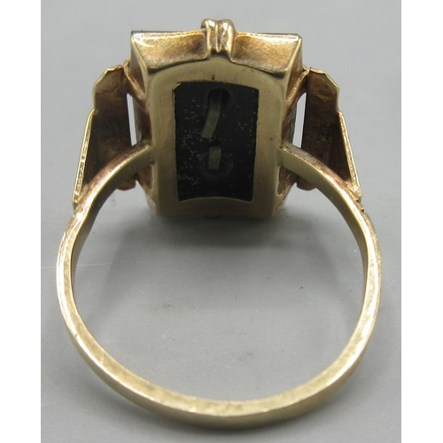 98 - 9ct gold ring set with polished black stone with D initial, size O1/2, stamped 9ct, a 9ct yellow gol... 