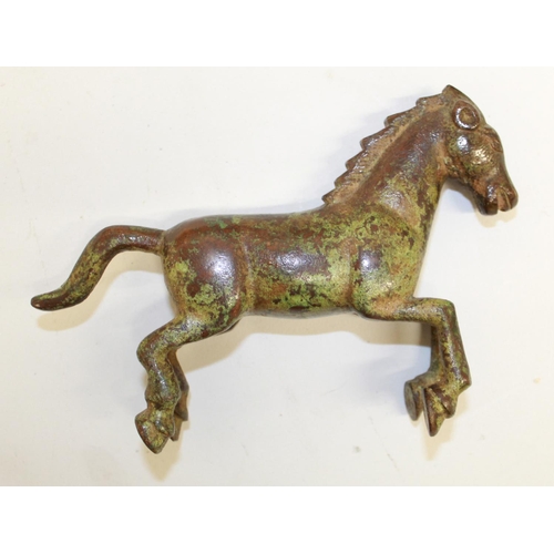 556 - Cast bronze figure of a galloping war horse, origin unknown