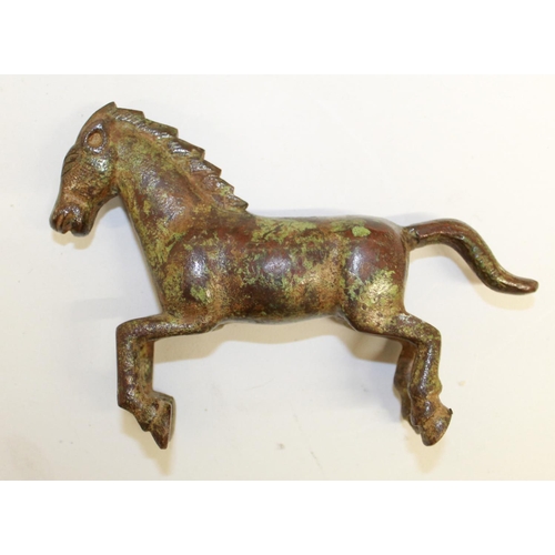 556 - Cast bronze figure of a galloping war horse, origin unknown