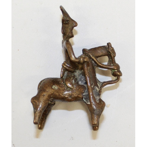 559 - Two cast bronze Indian 'spirit rider' figurines and a bronze bull