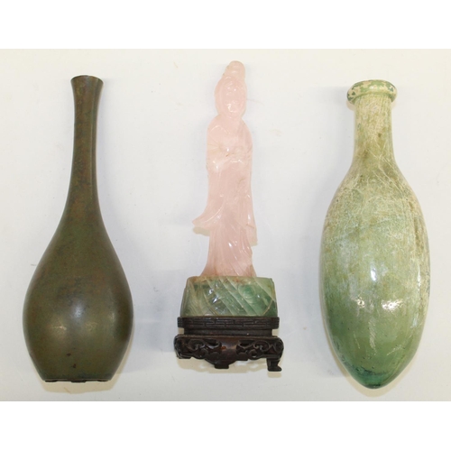 563 - Carved stone oil bottle, a glass torpedo bottle, and a soapstone carved goddess figurine