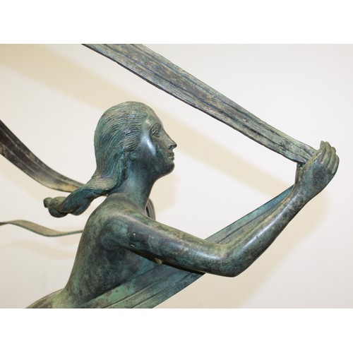 627 - Large bronze statue of woman ribbon dancing in athletic pose, with strong patina to extremities, H85... 