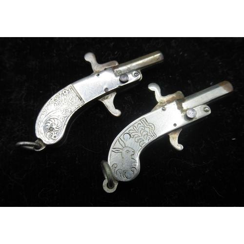 Pair of miniature pin fire fob pistols and bullets