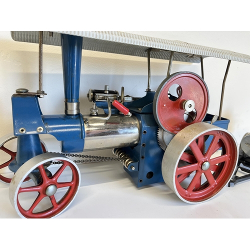 588 - Wilesco live steam traction engine 'Old Smokey' in blue and red livery, L31cm, with Wilesco water tr... 