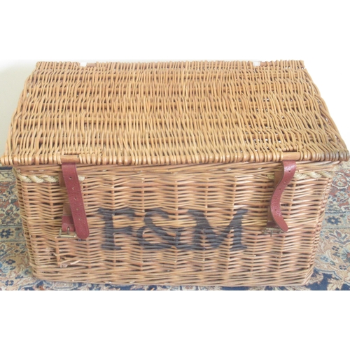 255 - Large wicker Fortnum and Mason basket with two leather straps and rope handles, front stencilled F&M... 