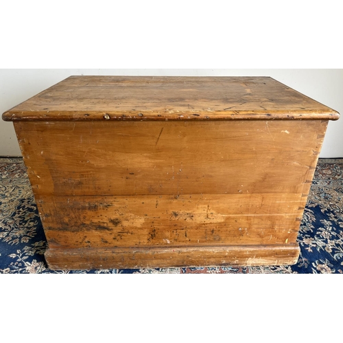 294 - Large stained pine blanket box, with hinged lid and wooden handles on skirted base, W100cm D64cm H65... 