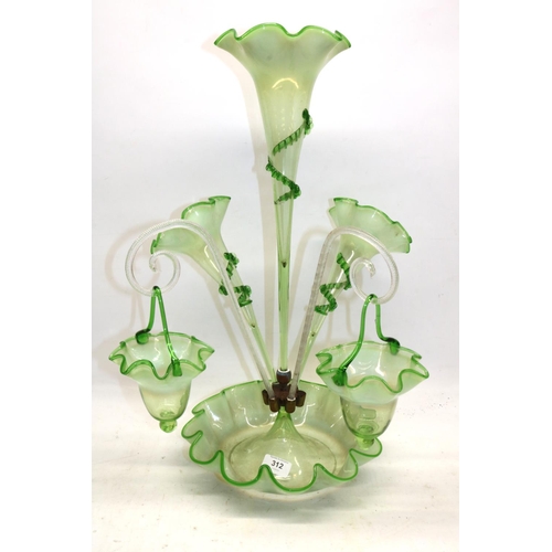 312 - Victorian opaline uranium glass epergne, the bowl with wavy rim, three trumpet shaped vases with app... 