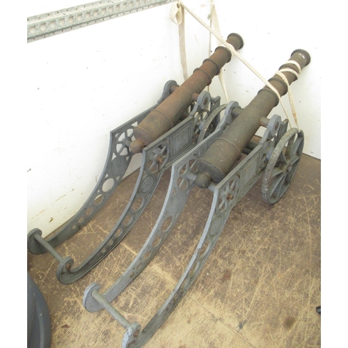 585 - Pair of cast iron garden cannons, L150cm